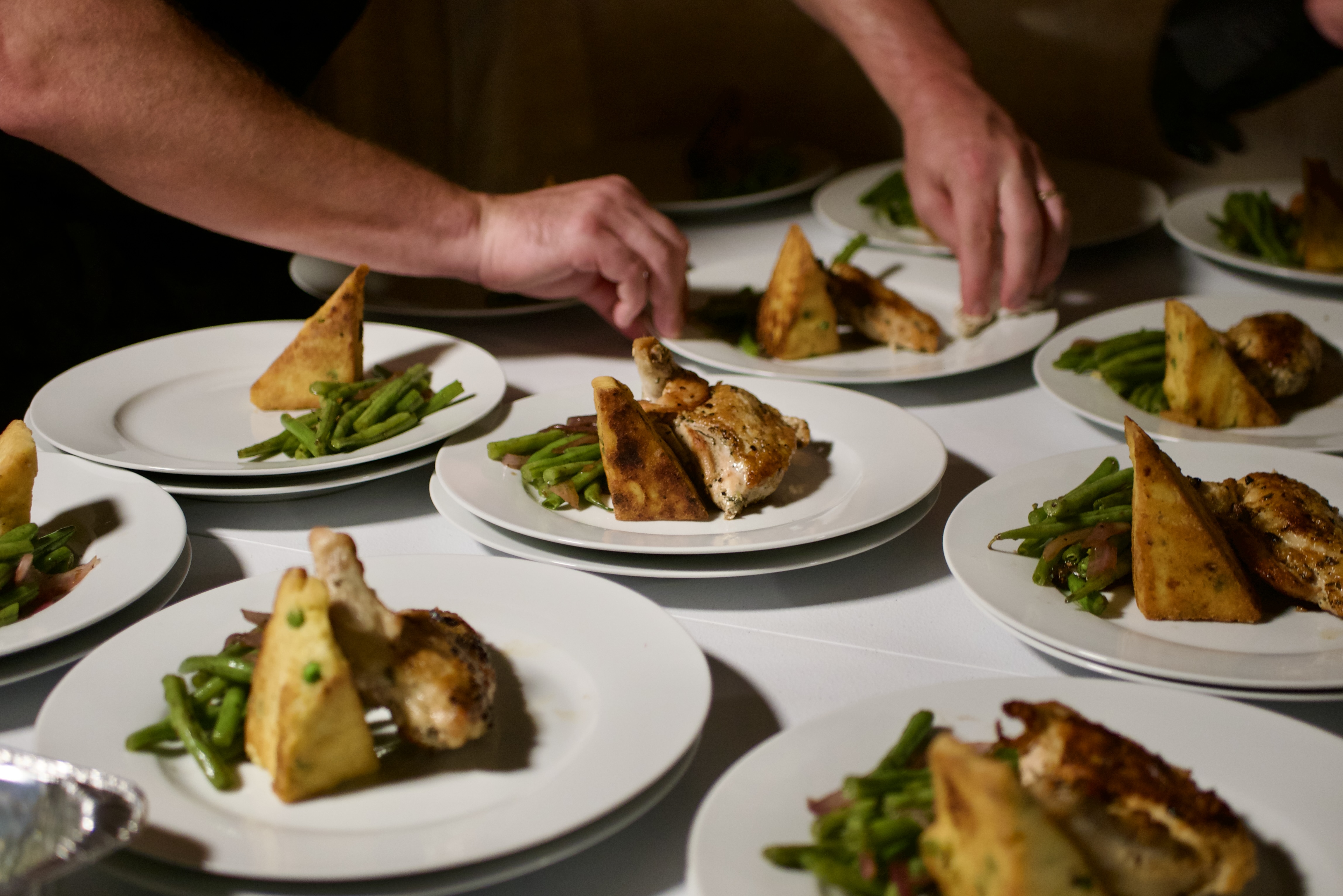 Plated entree with chicken and polenta